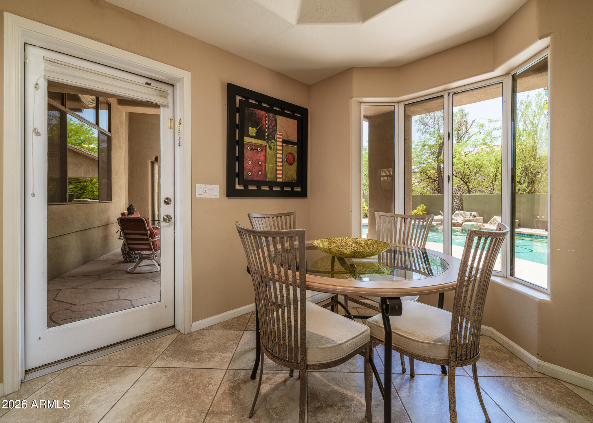 2329 East Hatcher Road Phoenix, AZ 85028 - Photo 13 of 40 a view of a dining room with furniture window and wooden floor