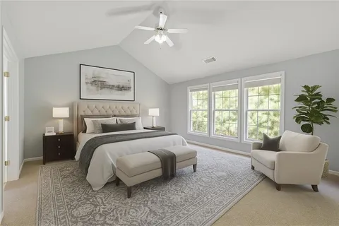 a view of an empty room with a fireplace and a window
