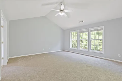 a view of empty room with a fireplace