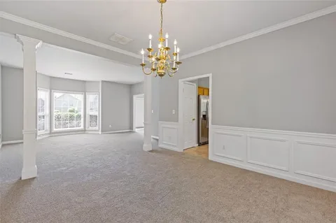 a kitchen with stainless steel appliances a stove sink and microwave