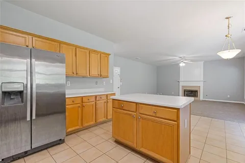 a view of a livingroom with a ceiling fan and window