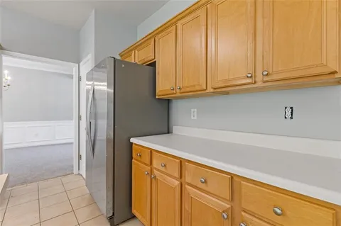 a view of staircase with wooden floor and white walls