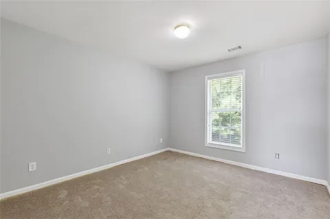 a white bath tub sitting next to a window