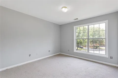 a house view with swimming pool in front of it