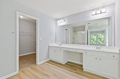 a picture of a bathroom with a shower