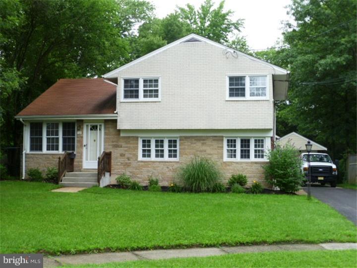 10 Briar Road Cherry Hill, NJ 08034 - Photo 1 of 25 a view of a house with a yard and plants