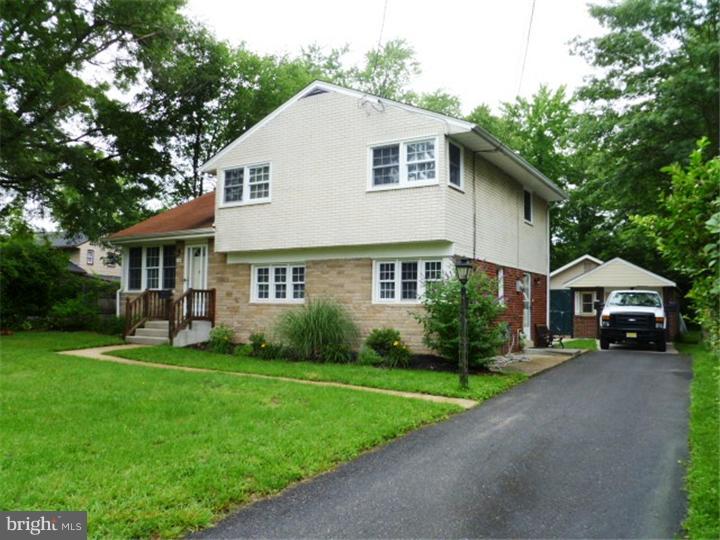 10 Briar Road Cherry Hill, NJ 08034 - Photo 2 of 25 a front view of a house with a garden and trees