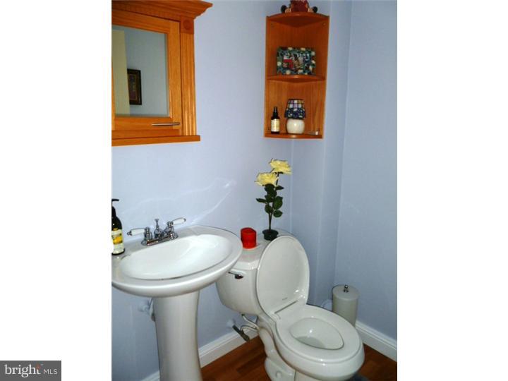10 Briar Road Cherry Hill, NJ 08034 - Photo 11 of 25 a white toilet sitting next to a bathroom sink