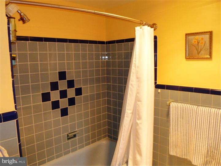 10 Briar Road Cherry Hill, NJ 08034 - Photo 14 of 25 a bathroom with a shower