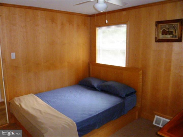 10 Briar Road Cherry Hill, NJ 08034 - Photo 17 of 25 a bedroom with a bed and a window