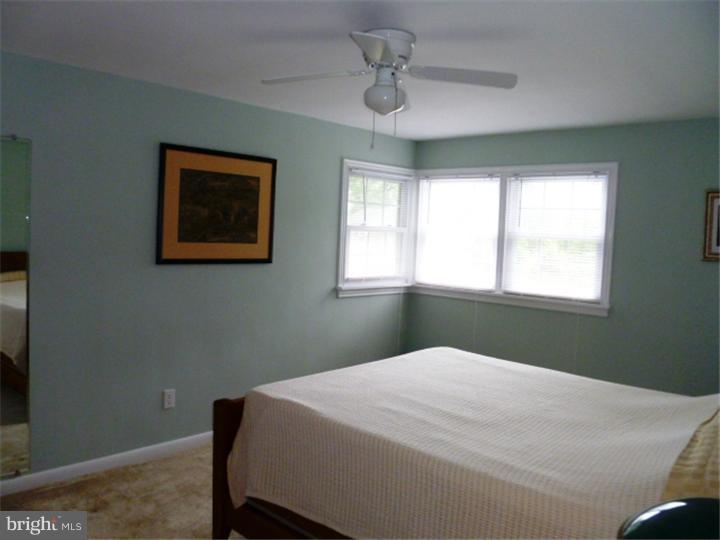 10 Briar Road Cherry Hill, NJ 08034 - Photo 18 of 25 a bedroom with a bed and a window