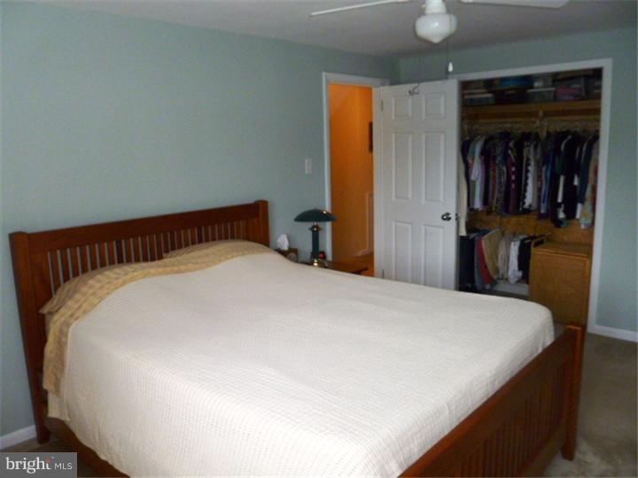 10 Briar Road Cherry Hill, NJ 08034 - Photo 19 of 25 a large bed sitting in a bedroom and closet
