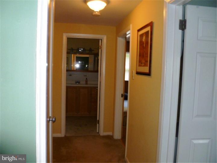 10 Briar Road Cherry Hill, NJ 08034 - Photo 21 of 25 a view of a bathroom from a hallway