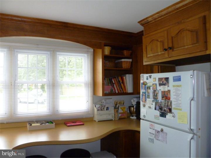 10 Briar Road Cherry Hill, NJ 08034 - Photo 9 of 25 a kitchen with a refrigerator and a window