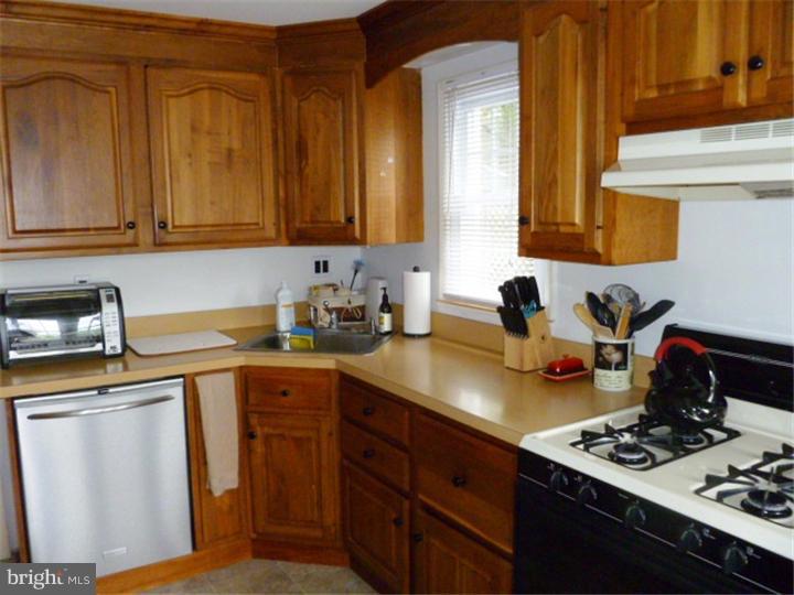 10 Briar Road Cherry Hill, NJ 08034 - Photo 10 of 25 a kitchen with stainless steel appliances a sink stove and cabinets