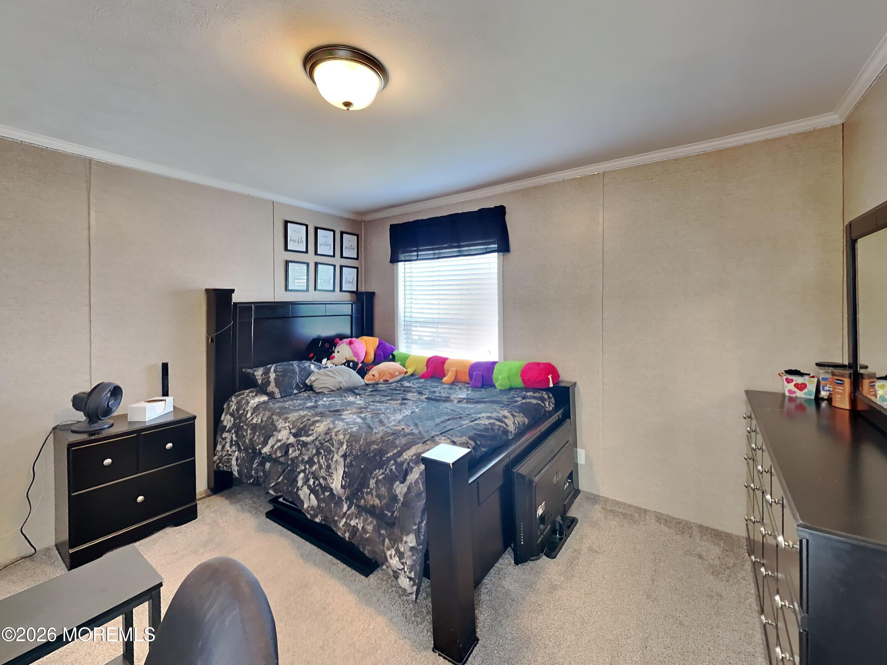 411 4th Street Jackson, NJ 08527 - Photo 11 of 15 a bedroom with a bed and a dresser