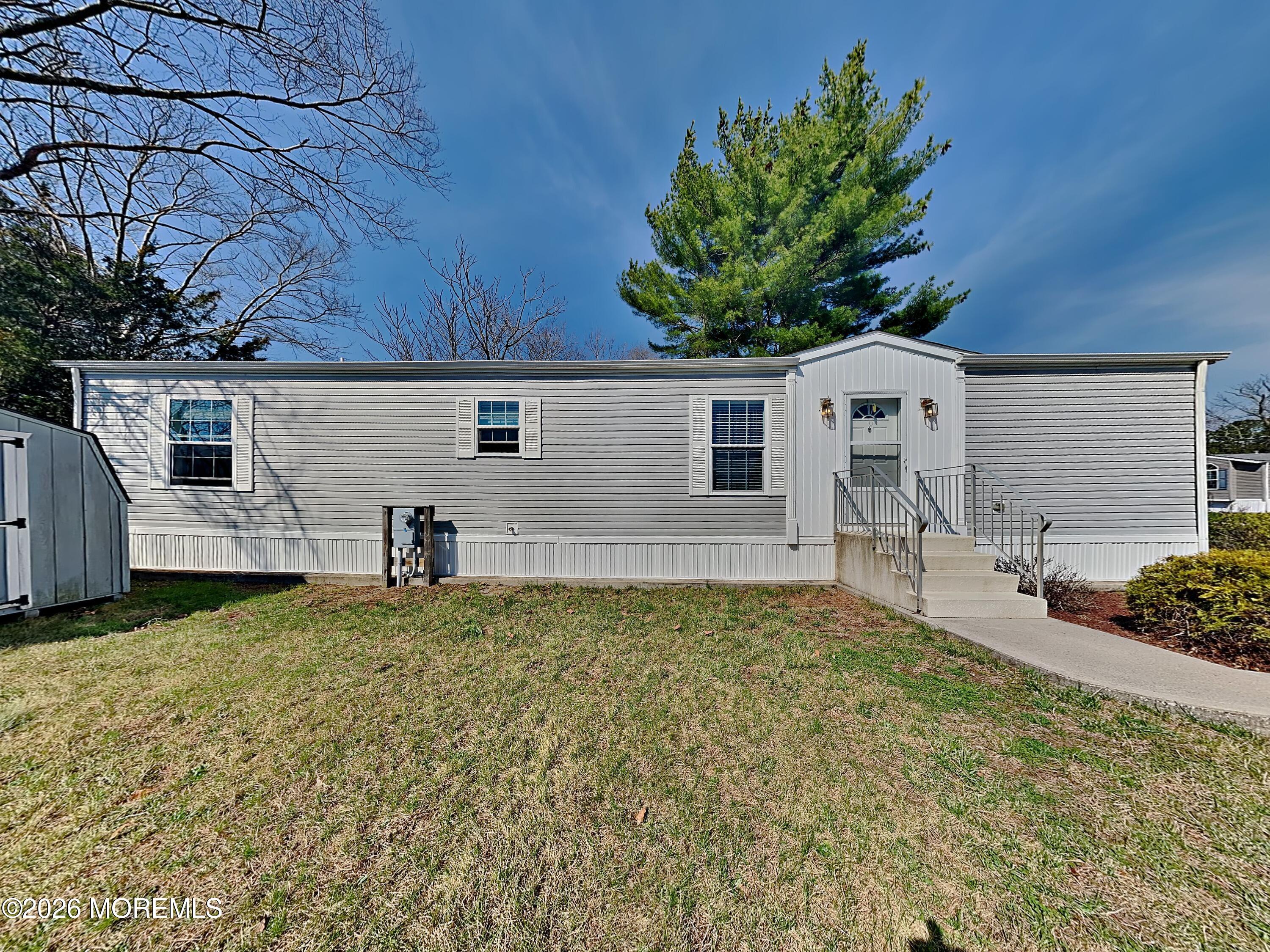 411 4th Street Jackson, NJ 08527 - Photo 2 of 15 a house with garden in front of it