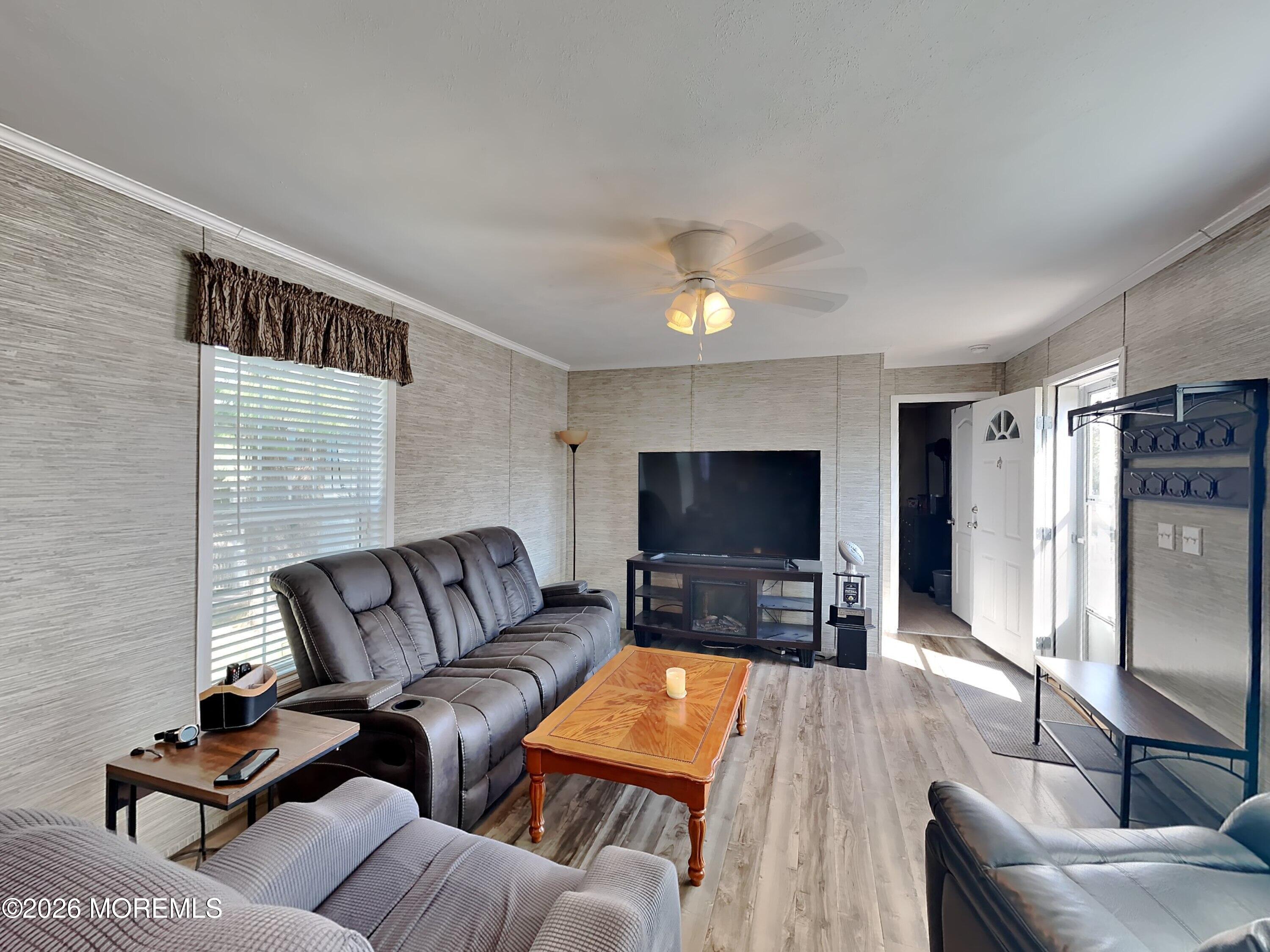 411 4th Street Jackson, NJ 08527 - Photo 4 of 15 a living room with furniture and a flat screen tv