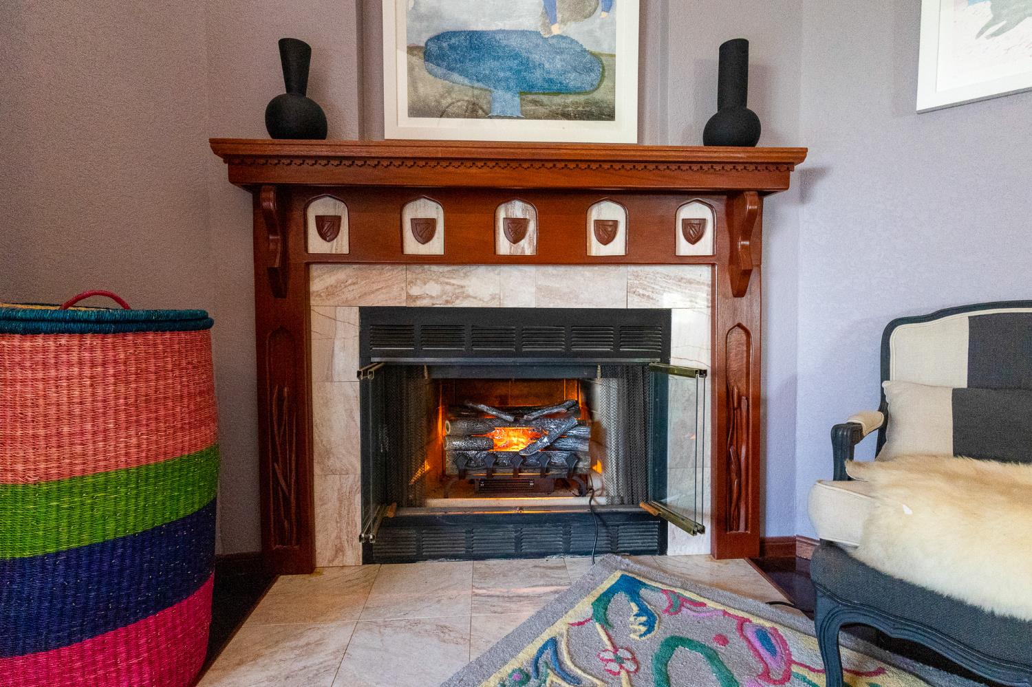 27689 Table Meadow Road Auburn, CA 95602 - Photo 30 of 72 a living room with a fireplace and a wooden floor