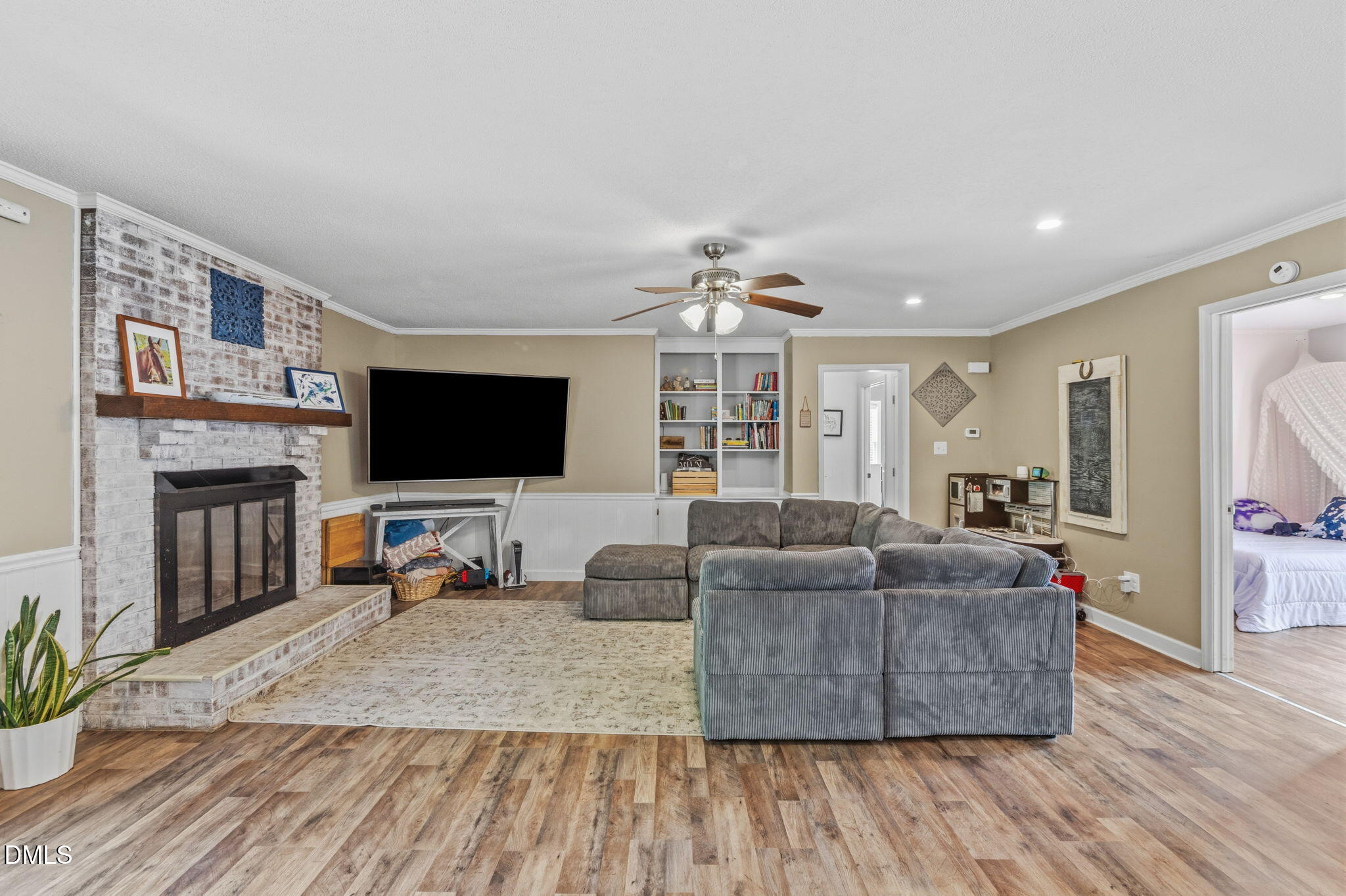 107 East F Street Butner, NC 27509 - Photo 16 of 47 a living room with furniture and a flat screen tv
