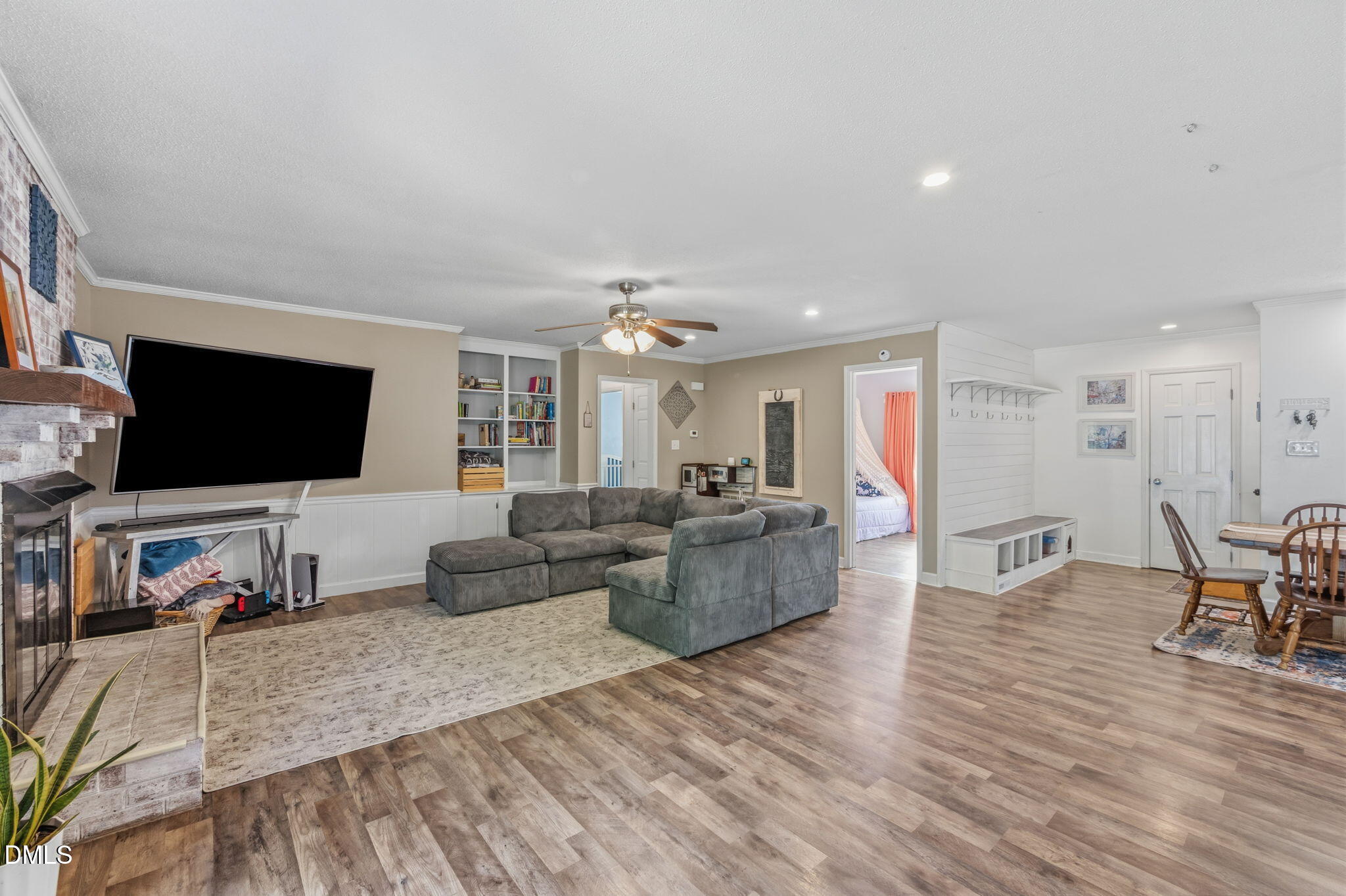 107 East F Street Butner, NC 27509 - Photo 17 of 47 a living room with furniture and a flat screen tv