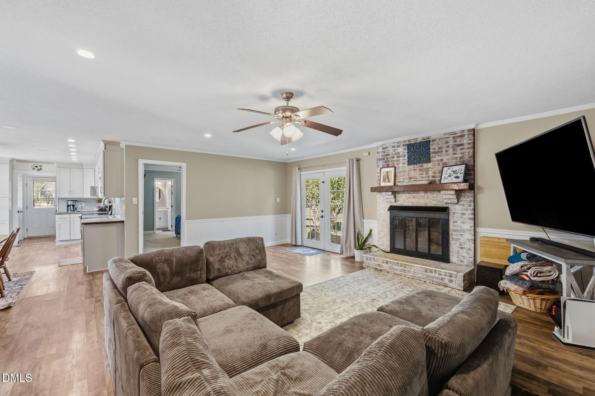 107 East F Street Butner, NC 27509 - Photo 19 of 47 a living room with furniture and a flat screen tv