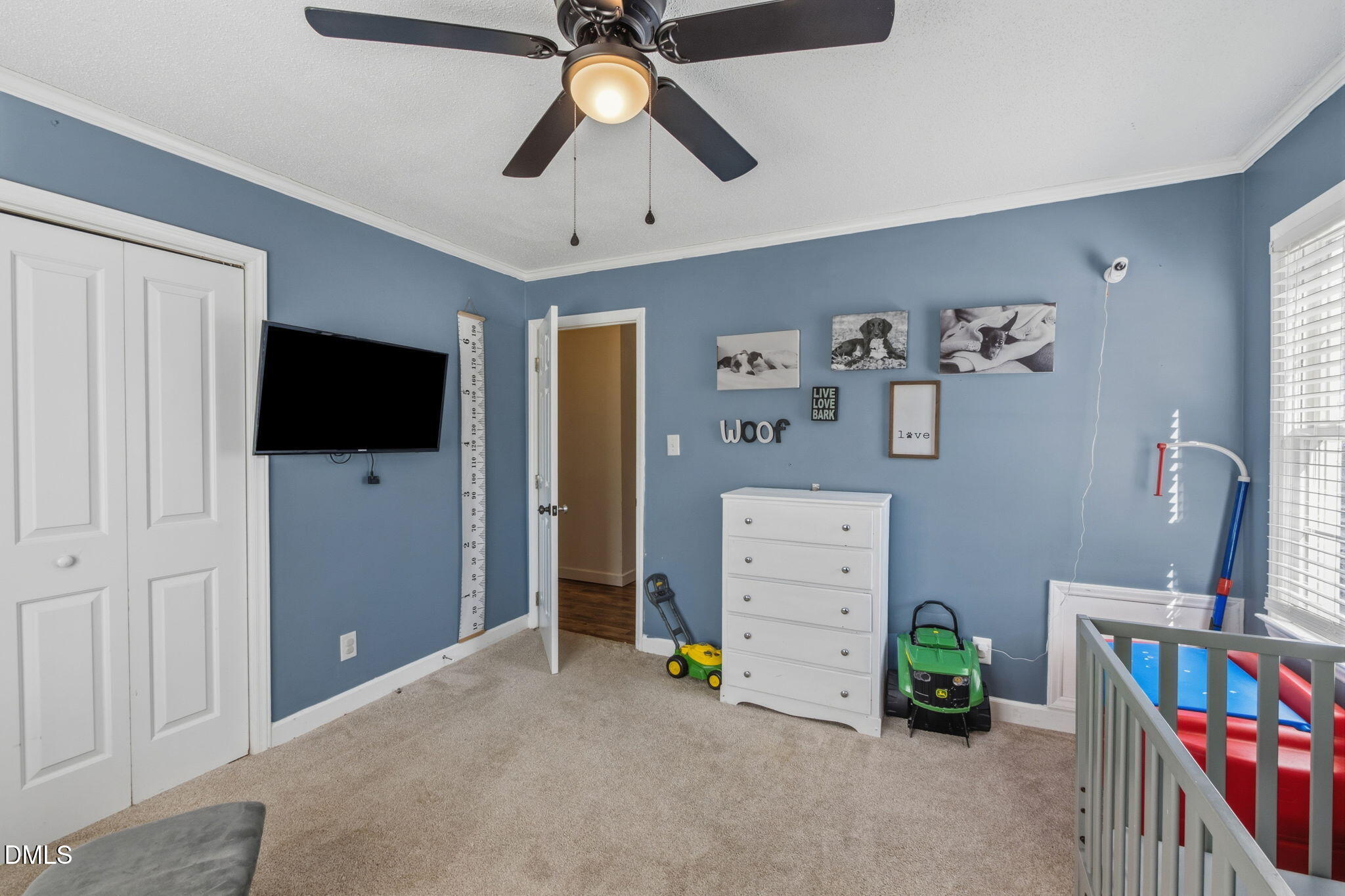107 East F Street Butner, NC 27509 - Photo 24 of 47 a view of room with furniture and a flat screen tv
