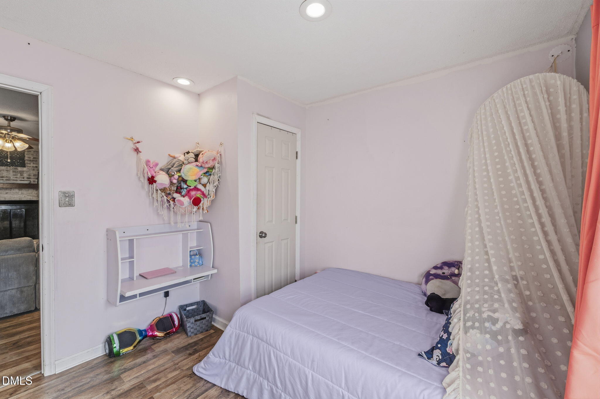 107 East F Street Butner, NC 27509 - Photo 28 of 47 a bedroom with a bed and a window