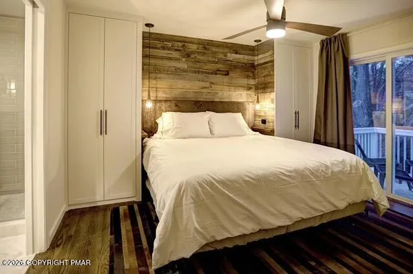 a bedroom with a bed and a walk in closet