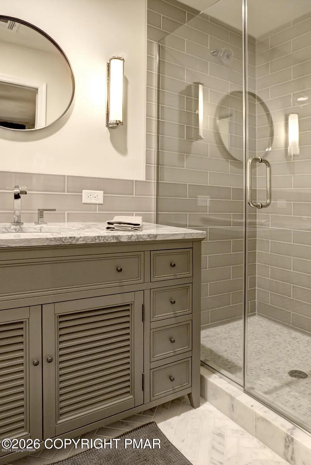137 Indian Trail Road Jim Thorpe, PA 18229 - Photo 7 of 12 a bathroom with a double vanity sink mirror and shower