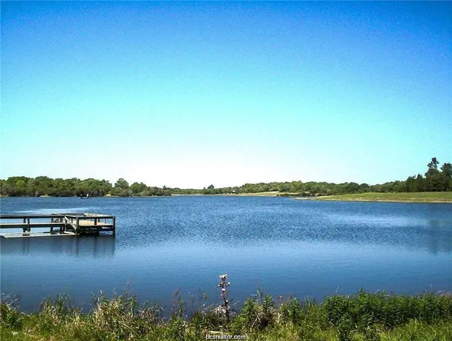 a view of a lake with mountain in the background