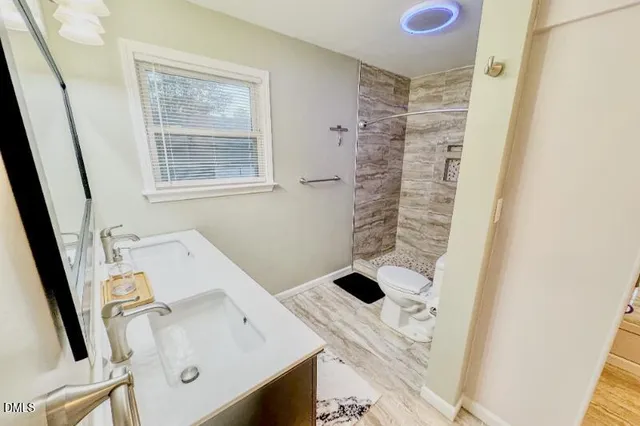 a view of backyard with a deck and wooden floor