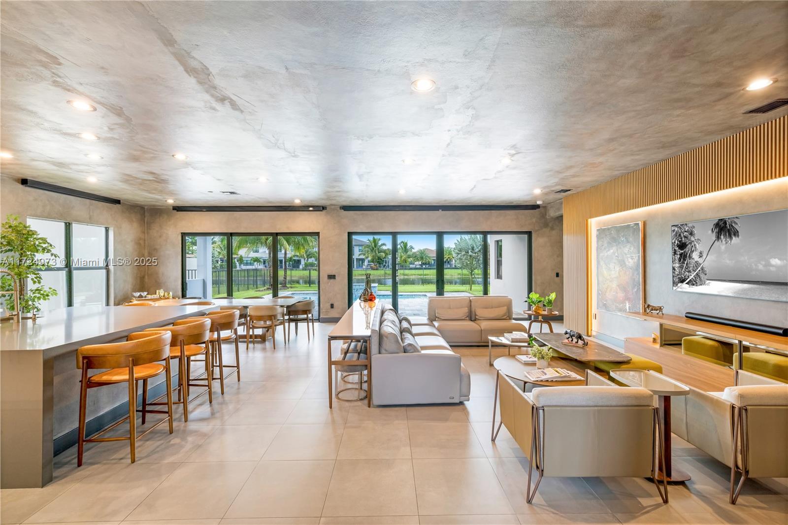 8853 New River Falls Road Boca Raton, FL 33496 - Photo 1 of 35 a living room with furniture and large windows