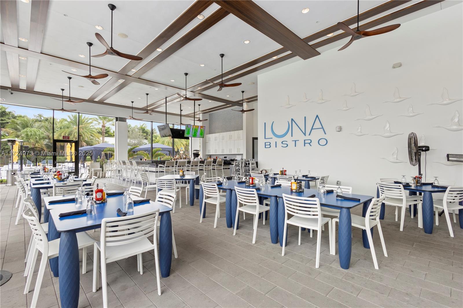 8853 New River Falls Road Boca Raton, FL 33496 - Photo 30 of 35 a view of a dining area with furniture window and outside view