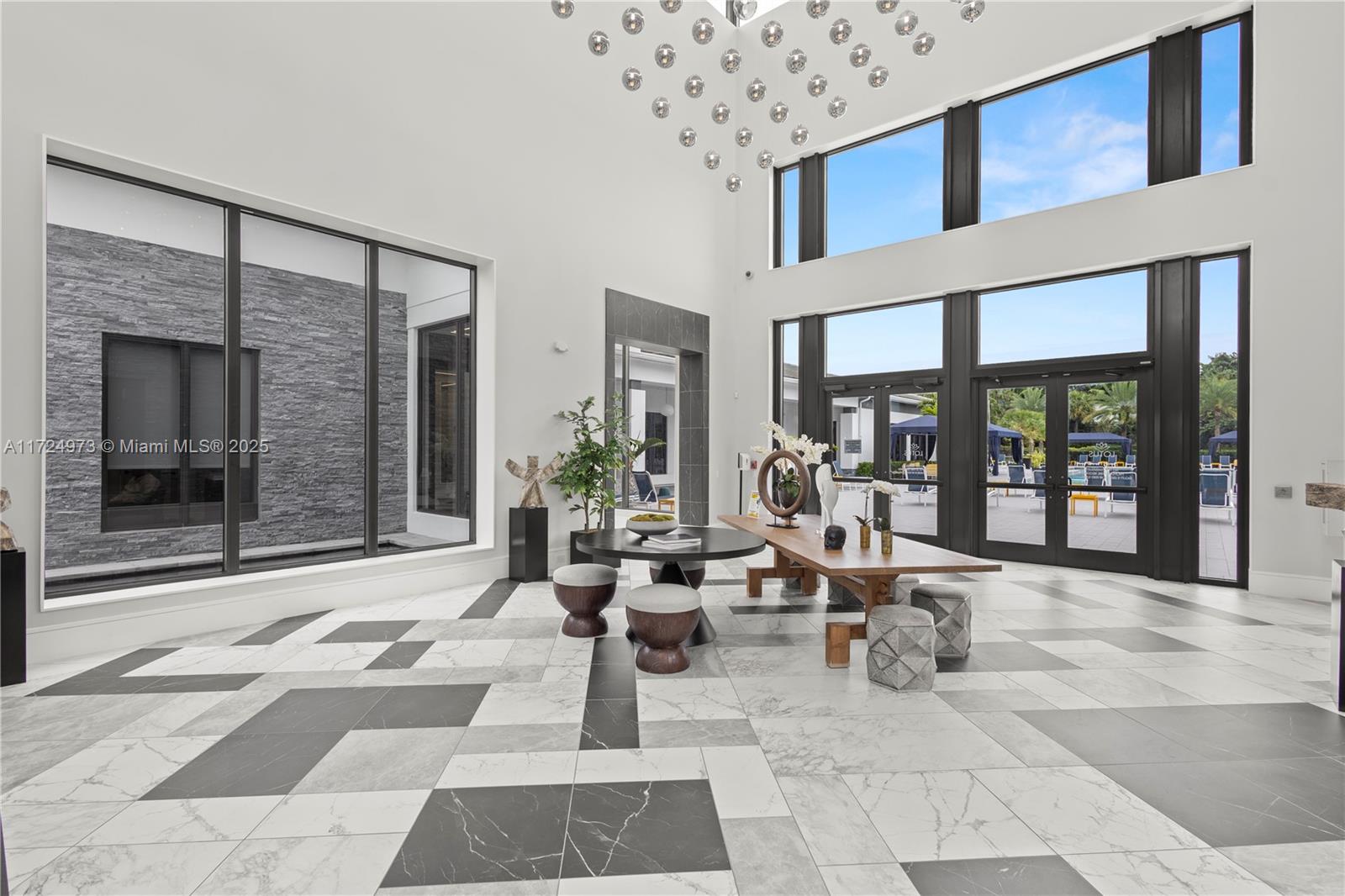 8853 New River Falls Road Boca Raton, FL 33496 - Photo 33 of 35 a living room with furniture and large windows