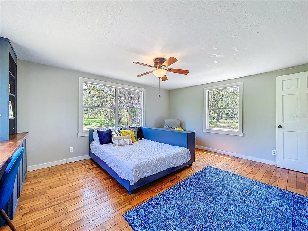 5870 Jim Davis Road Parrish, FL 34219 - Photo 26 of 39 2nd bedroom surrounded by lots of light.