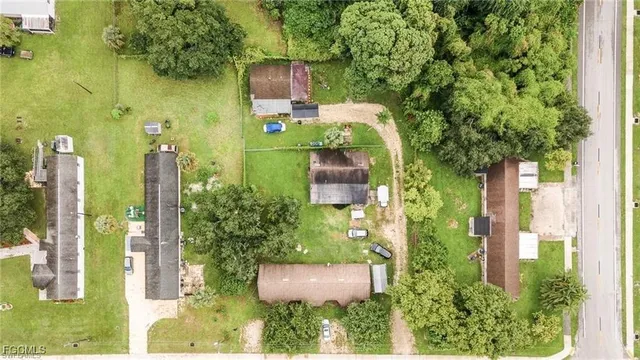 aerial view of a house with a yard