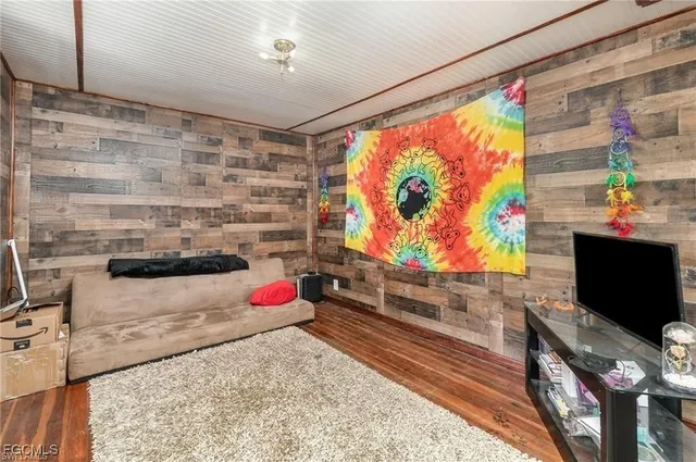 a living room with a couch and a flat screen tv