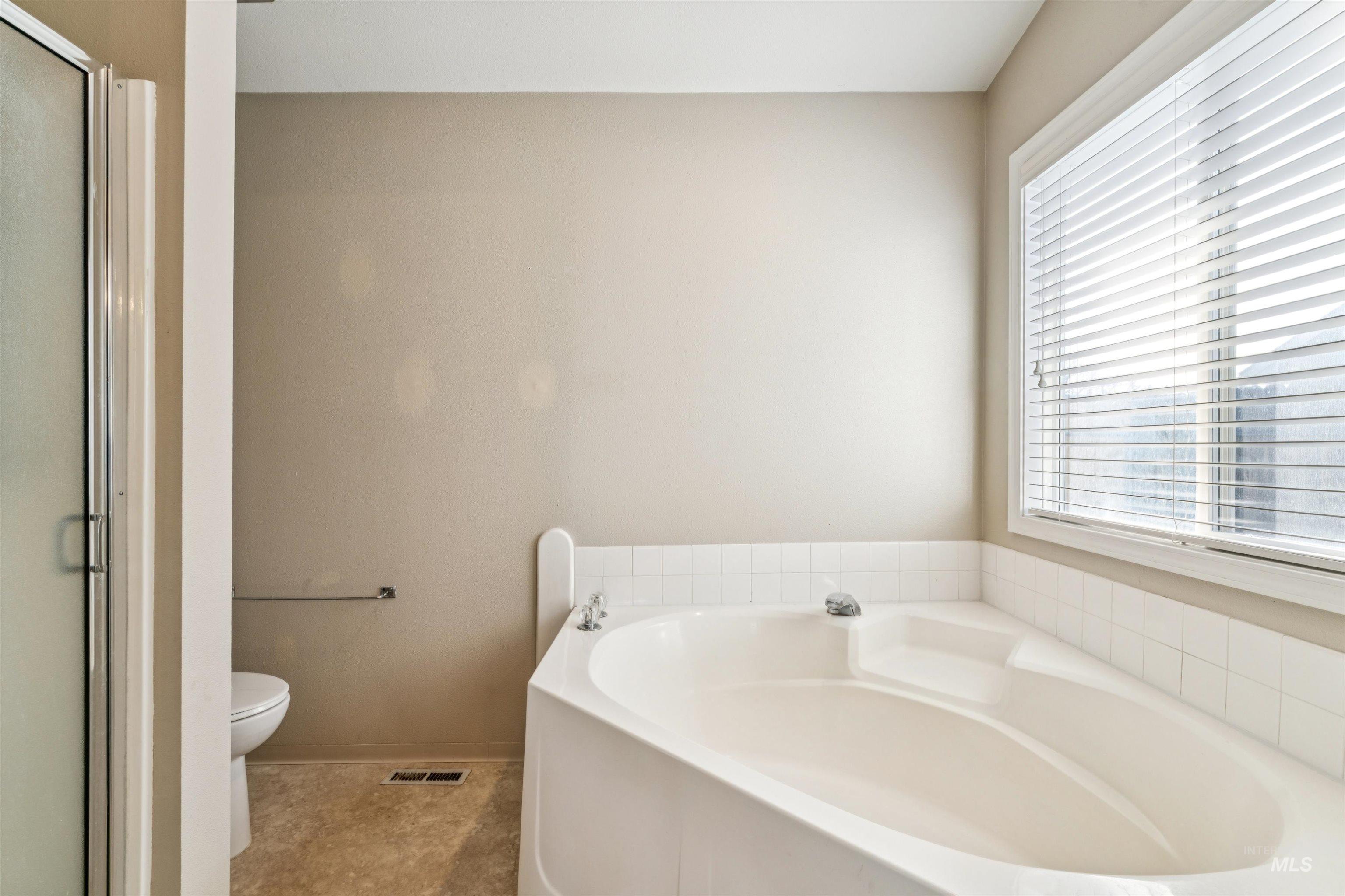 11968 West Bronte Street Boise, ID 83709 - Photo 25 of 48 Full bathroom with a bath and a stall shower