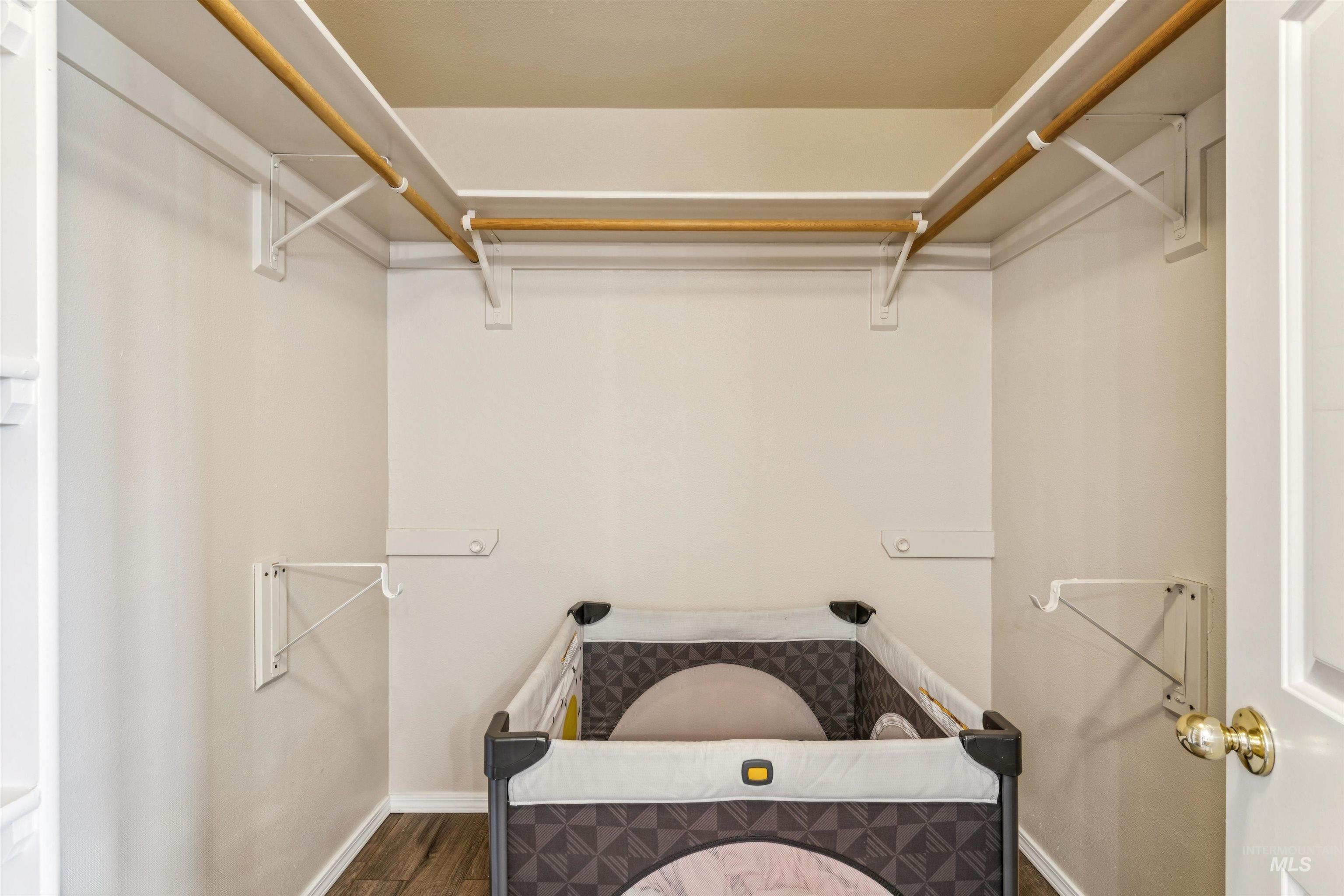 11968 West Bronte Street Boise, ID 83709 - Photo 30 of 48 Spacious closet featuring dark wood finished floors