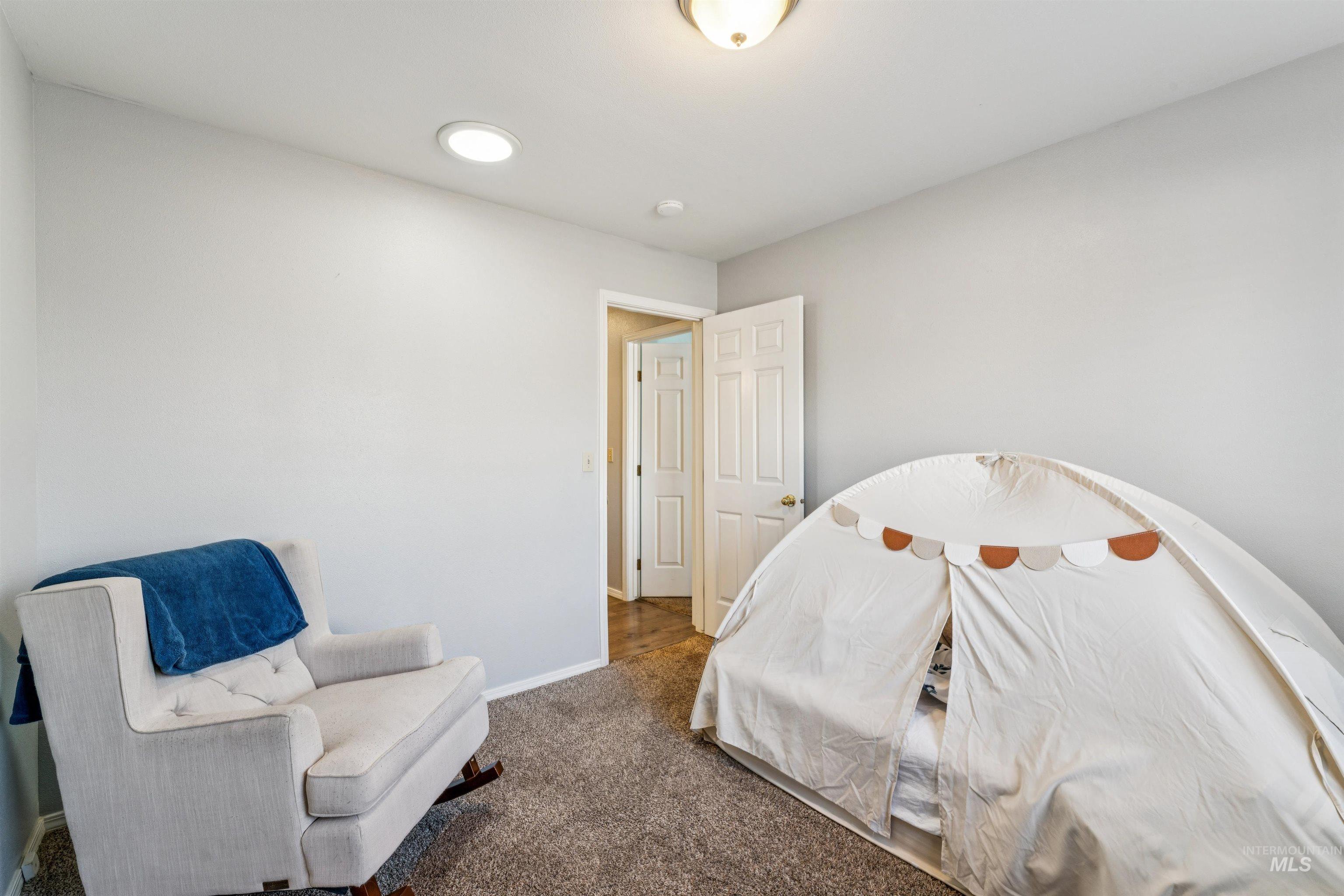 11968 West Bronte Street Boise, ID 83709 - Photo 32 of 48 Carpeted bedroom with baseboards