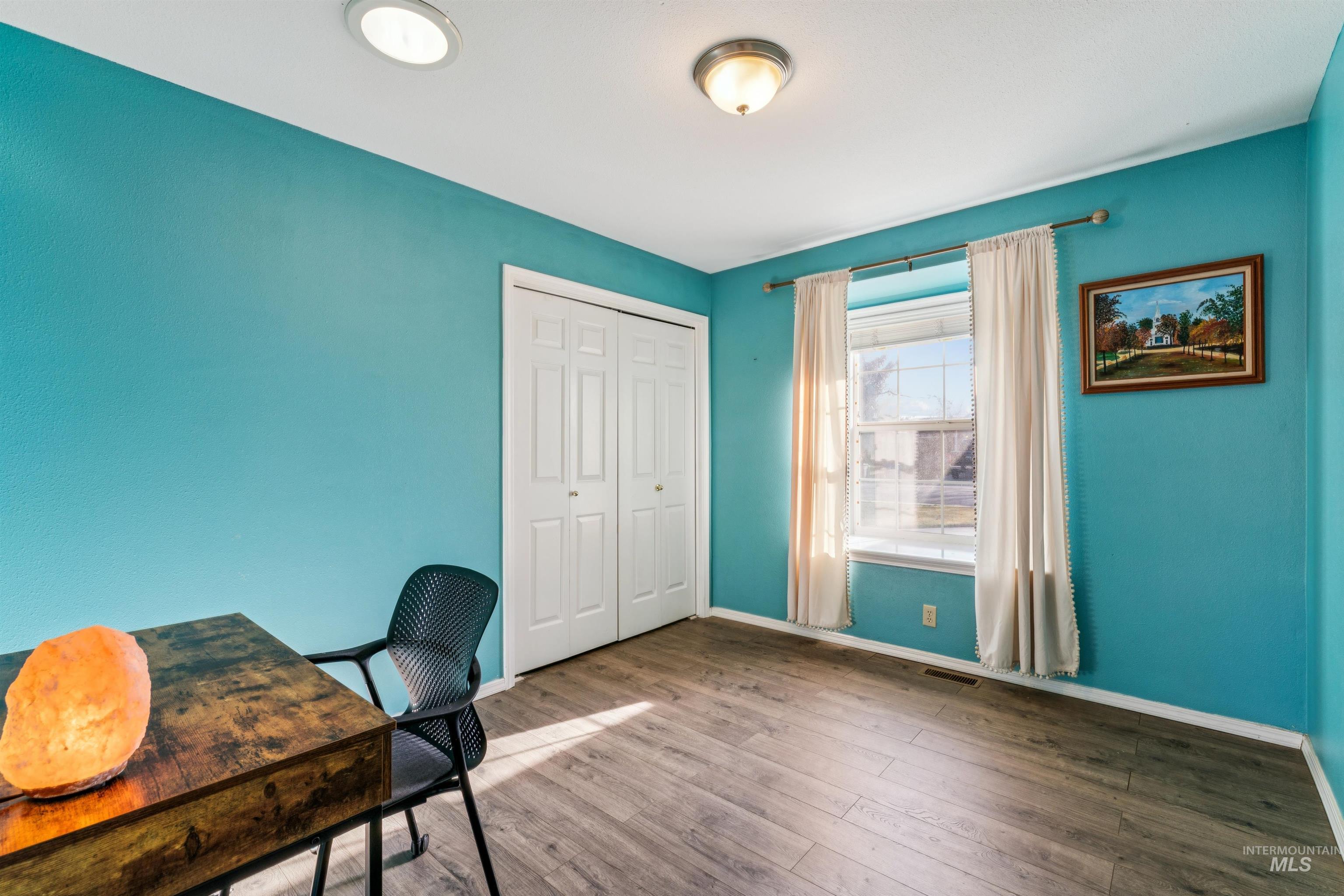 11968 West Bronte Street Boise, ID 83709 - Photo 33 of 48 Home office with baseboards and wood finished floors