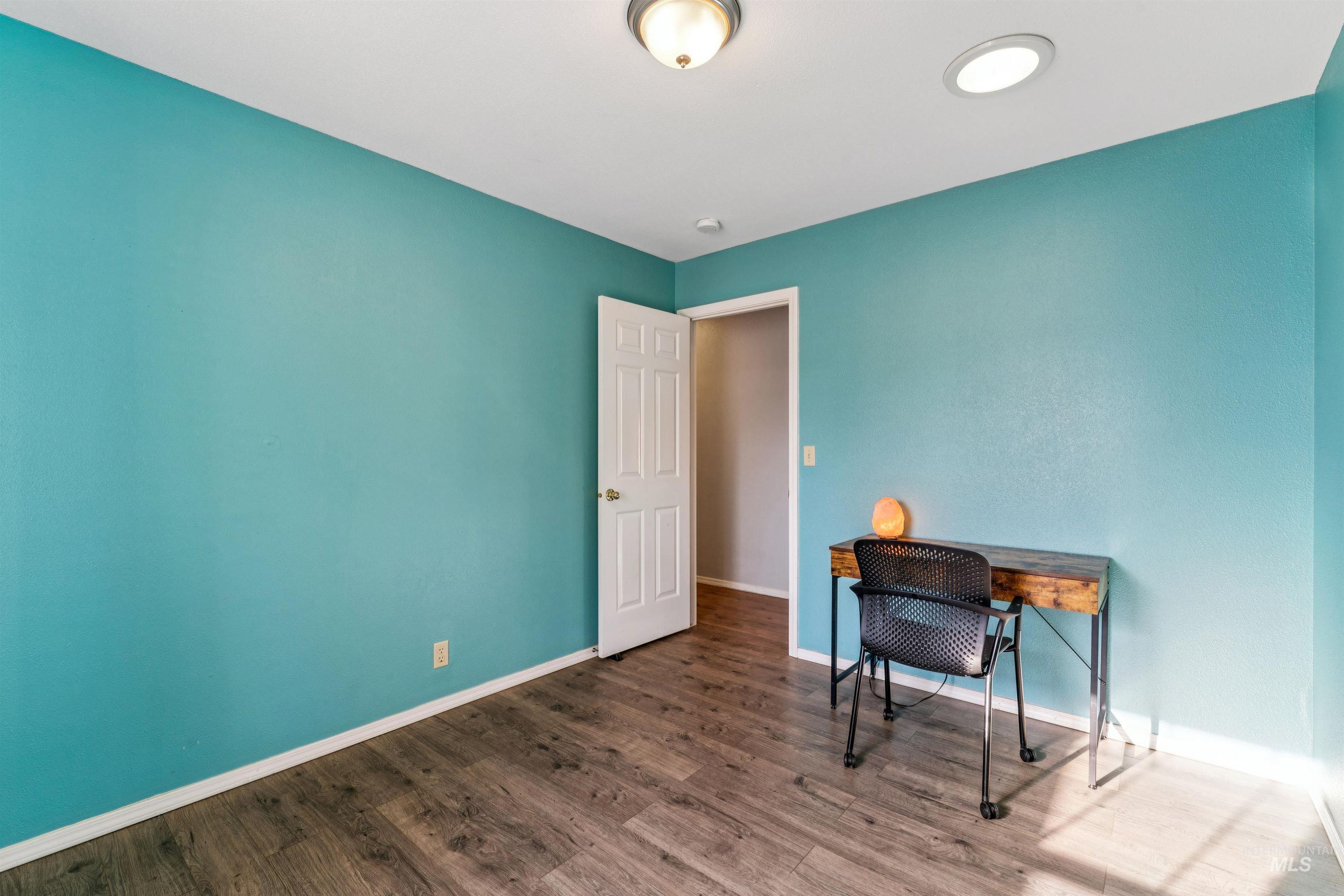 11968 West Bronte Street Boise, ID 83709 - Photo 34 of 48 Home office with baseboards and wood finished floors