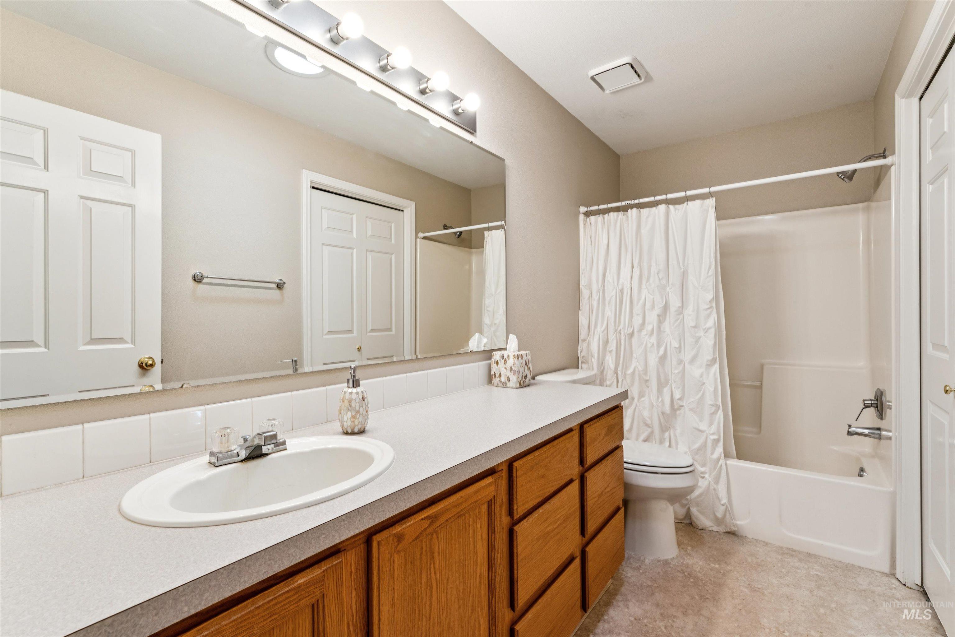 11968 West Bronte Street Boise, ID 83709 - Photo 35 of 48 Full bath featuring vanity and shower / bath combo with shower curtain