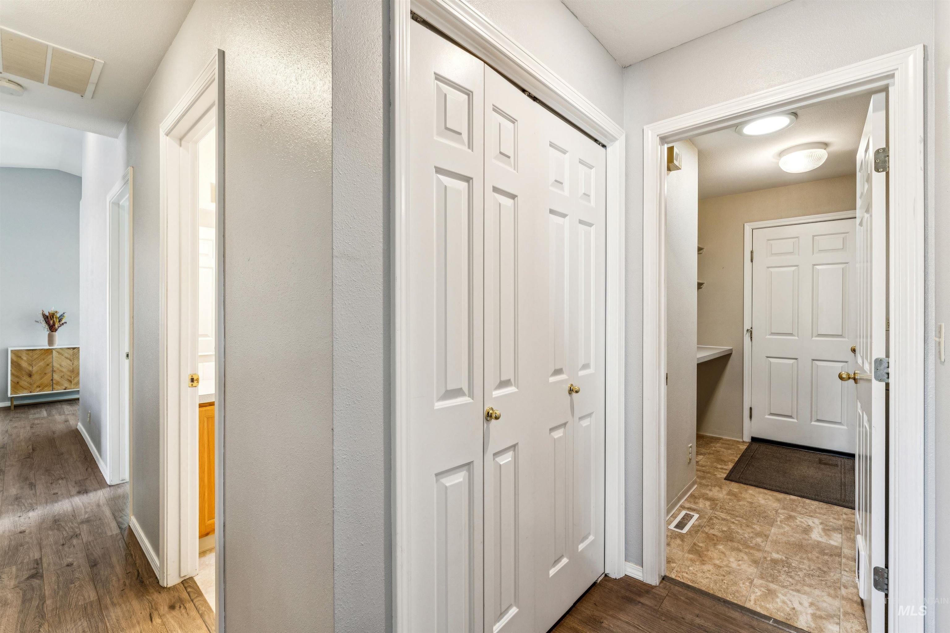 11968 West Bronte Street Boise, ID 83709 - Photo 36 of 48 Hallway featuring dark wood-type flooring and baseboards
