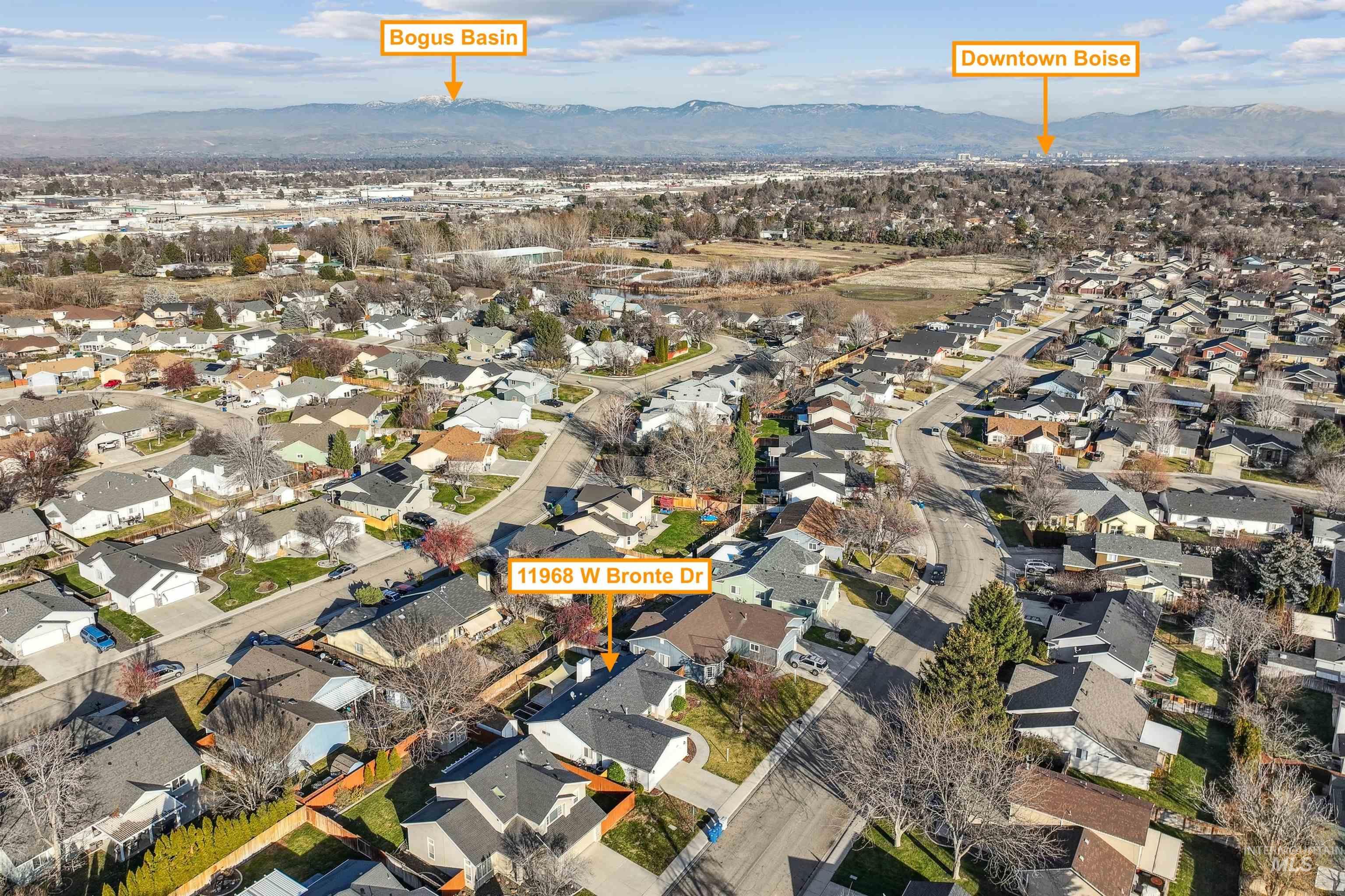11968 West Bronte Street Boise, ID 83709 - Photo 45 of 48 Aerial view of property and surrounding area featuring nearby suburban area and a mountainous background