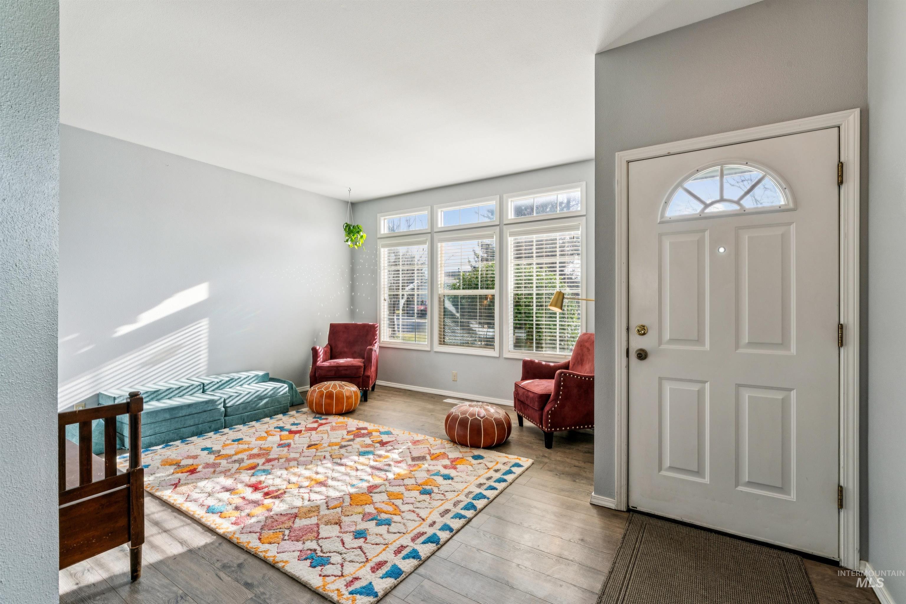11968 West Bronte Street Boise, ID 83709 - Photo 7 of 48 Foyer entrance featuring healthy amount of natural light and hardwood / wood-style flooring