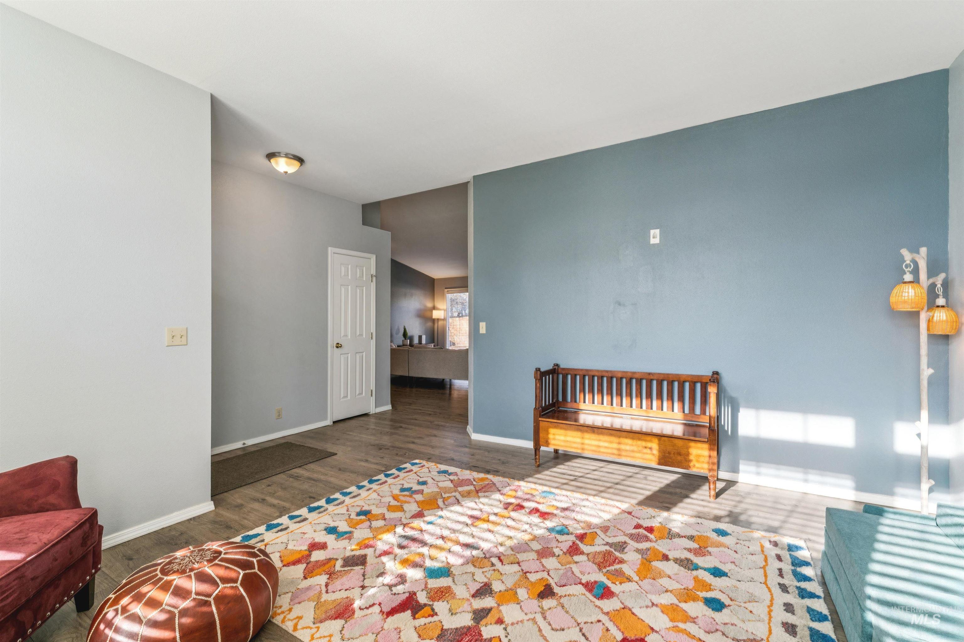 11968 West Bronte Street Boise, ID 83709 - Photo 10 of 48 Bedroom featuring baseboards and wood finished floors