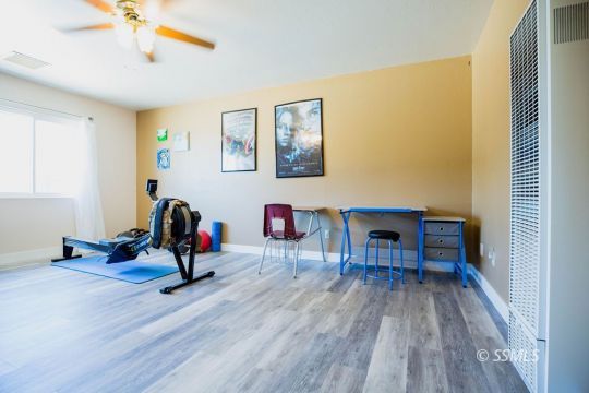 2030 South Inyo Street Ridgecrest, CA 93555 - Photo 30 of 42 a view of a livingroom with furniture and gym equipment