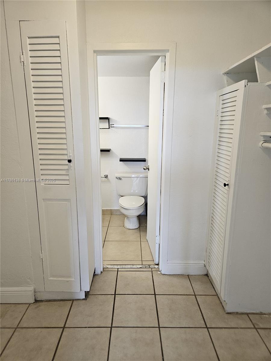 1805 Sans Souci Boulevard, Unit 302R North Miami, FL 33181 - Photo 16 of 33 a bathroom with a toilet